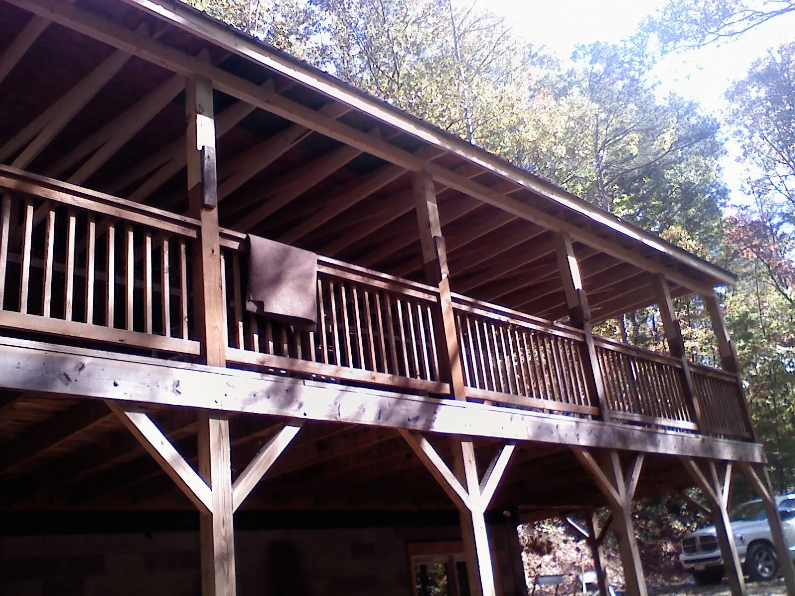 Timber framing under a new elevated porch and deck — Roof Leak Repair in Livonia by Roofing Brothers